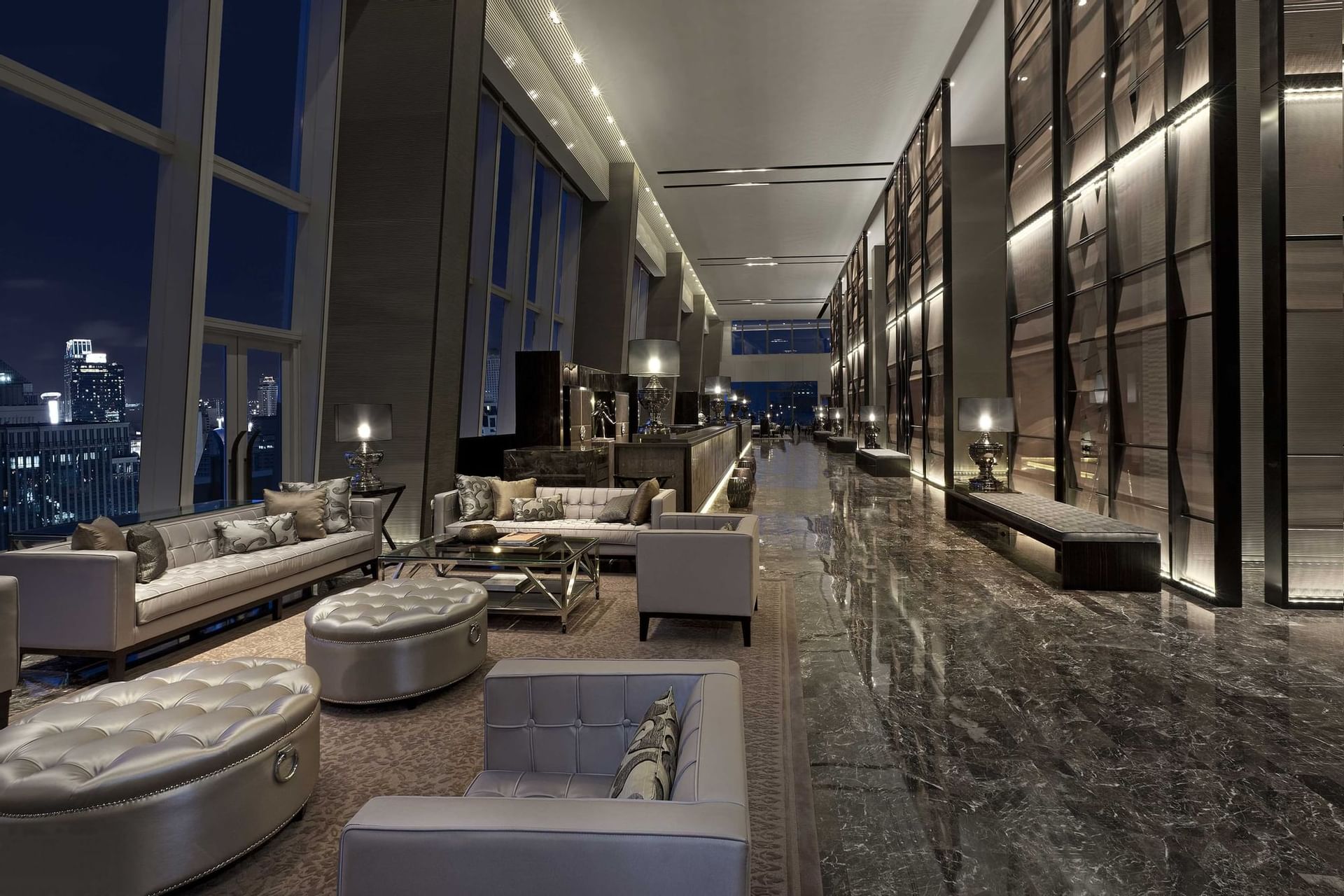 Lobby with the lounge at Okura Prestige Bangkok at night time