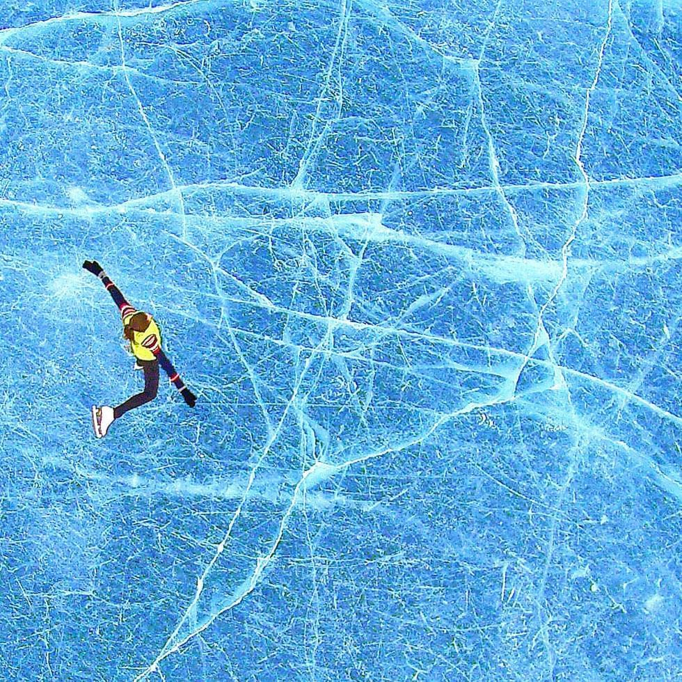Aerial view of a girl doing ice skating, Falkensteiner Hotels