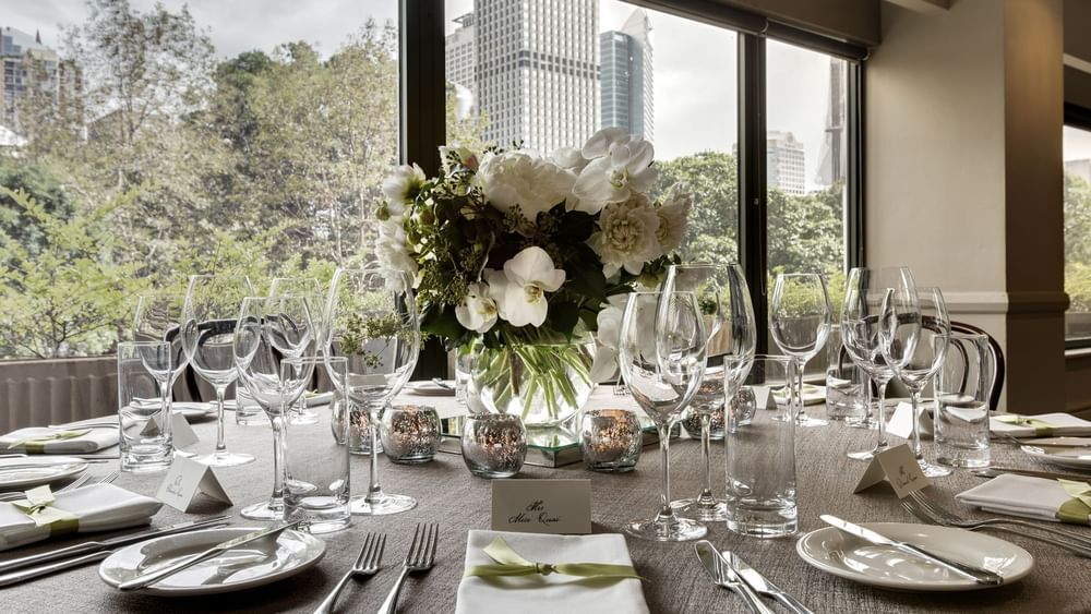 Close-up of arranged banquet table with flower vase in Ibis Ballroom at Pullman Sydney Hyde Park