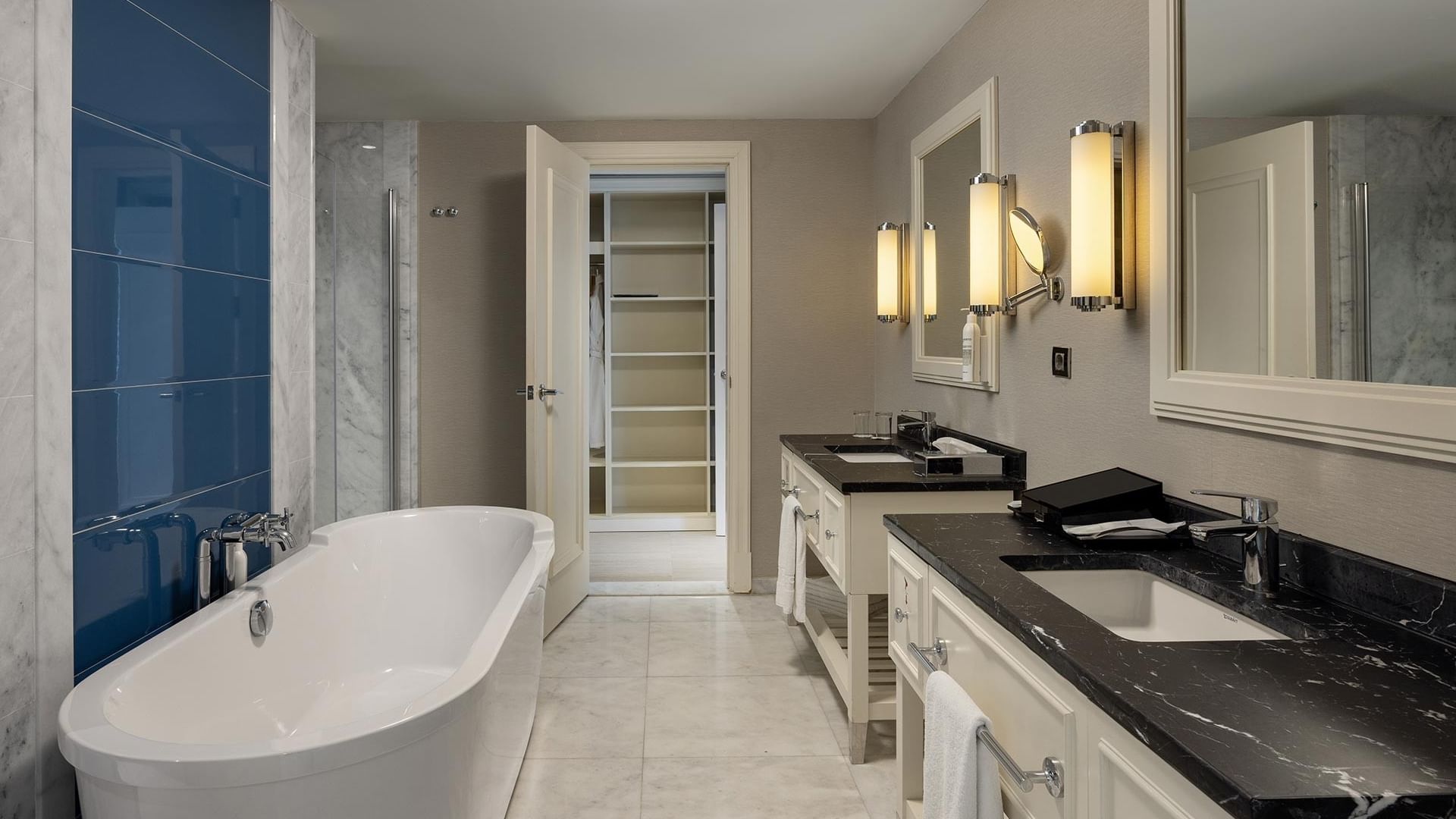 Elegant bathroom with bathtub and dual vanity in Deluxe Room at Titanic Deluxe Golf Belek, Antalya.
