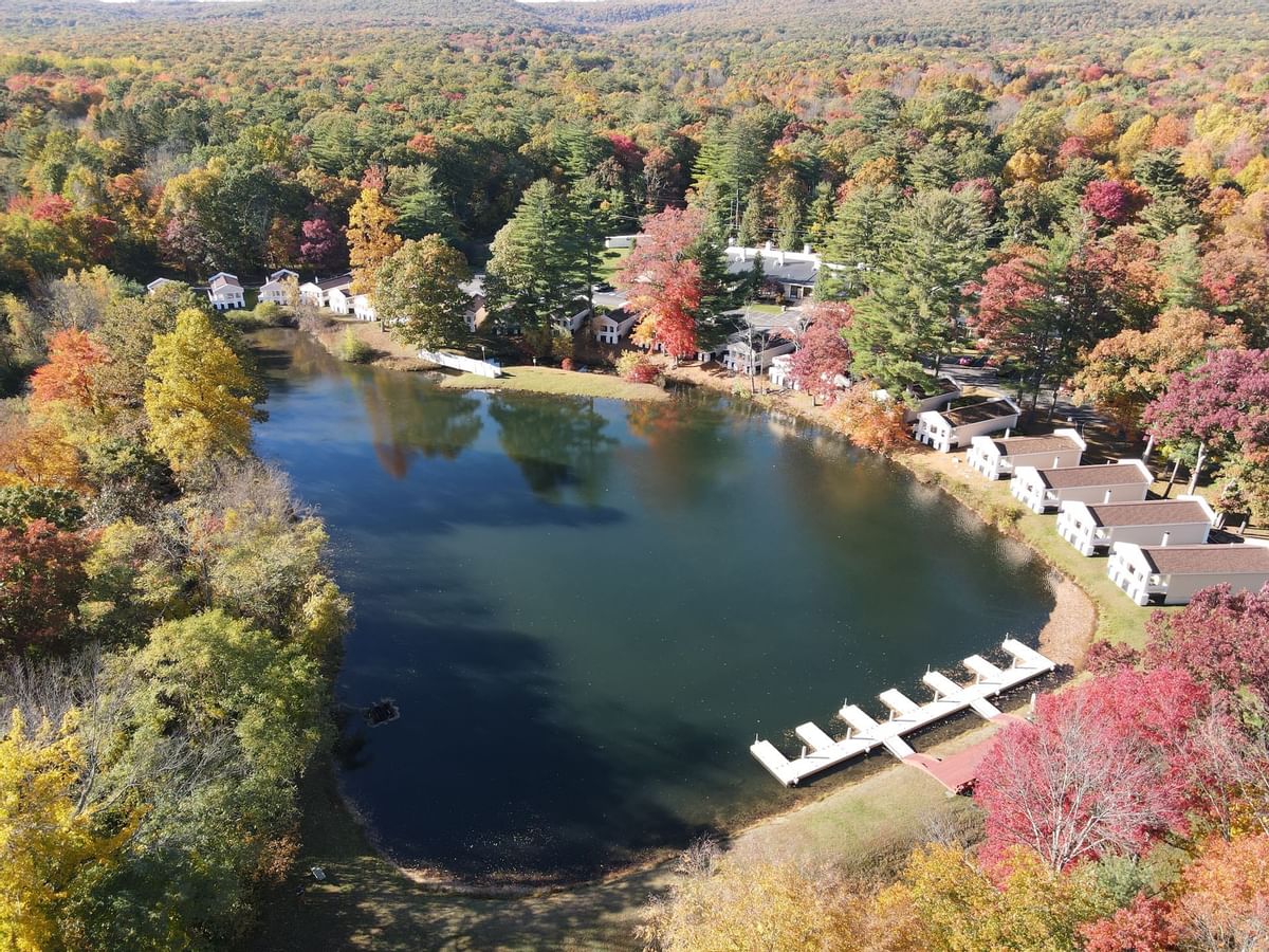 Aerial view of a serene lake surrounded by colorful autumn foliage at Paradise Stream Resort