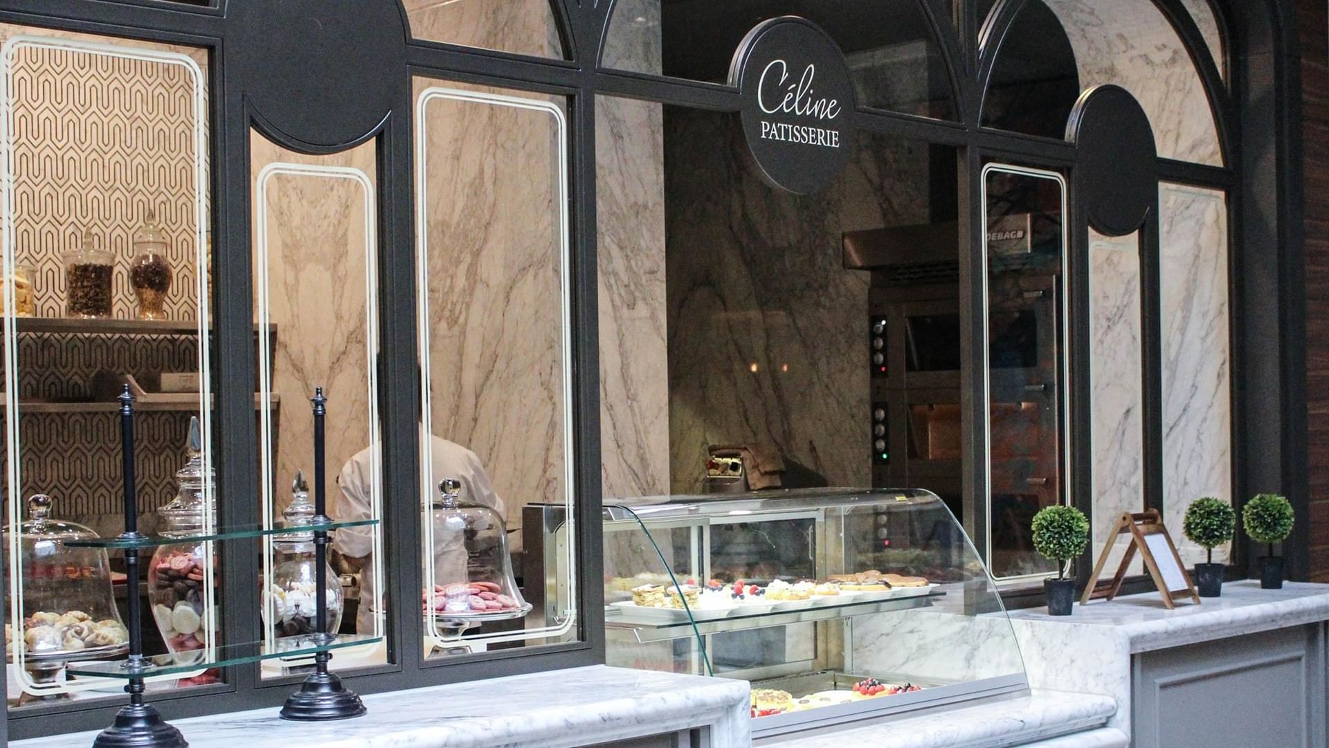 Display of various desserts including cakes and pastries in Céline Patisserie at Titanic Chaussee Berlin