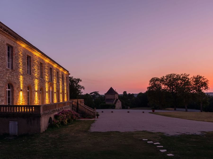 Exterior view of The Hotel at sunset in Chateau du Tauzies