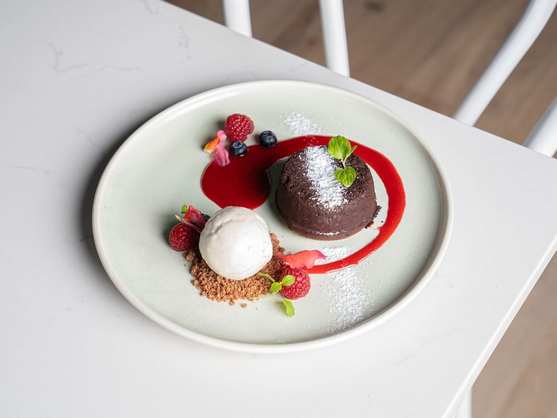 Fine chocolate & berry dessert served on a Room table at Pullman King George Square