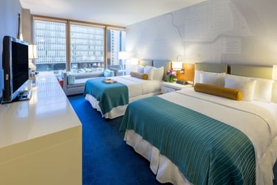 Two beds in Deluxe City View Double Queen Room at Kinzie Hotel