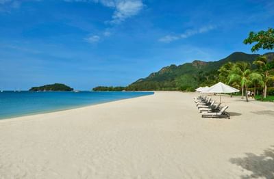 Landscape view of the beach with sunbeds at The Danna Langkawi