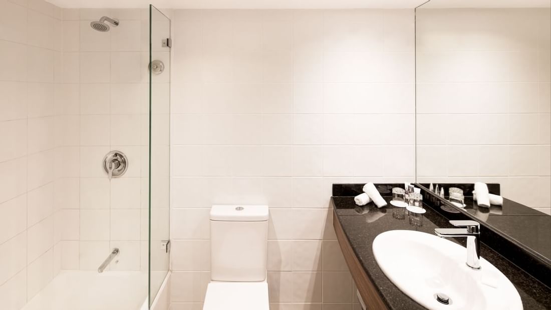 Family Room bathroom featuring vanity with lavatory and walk-in shower at Novotel Sydney International Airport