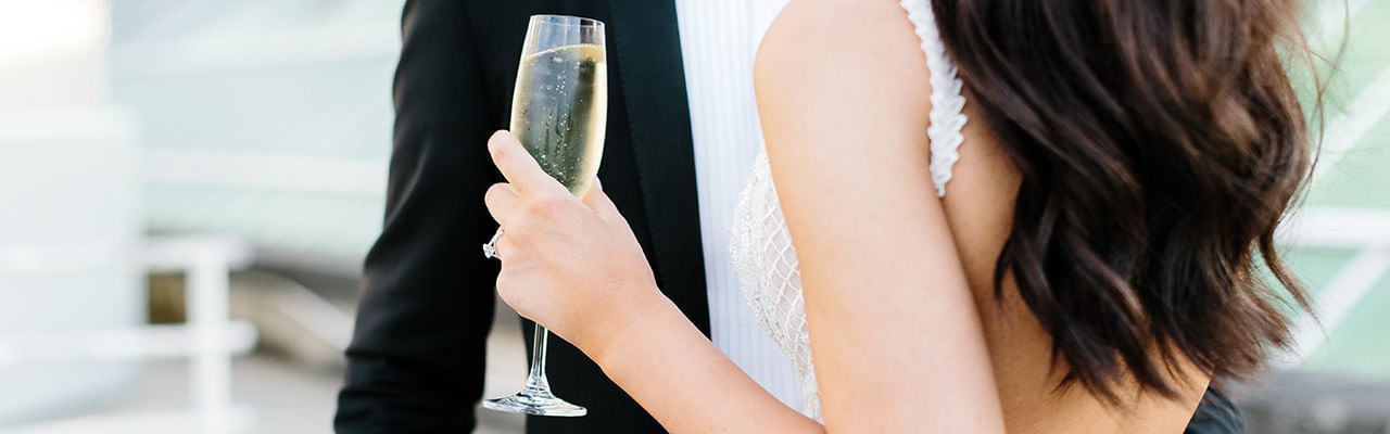 Bride holding a wine glass at Crown Hotel Melbourne