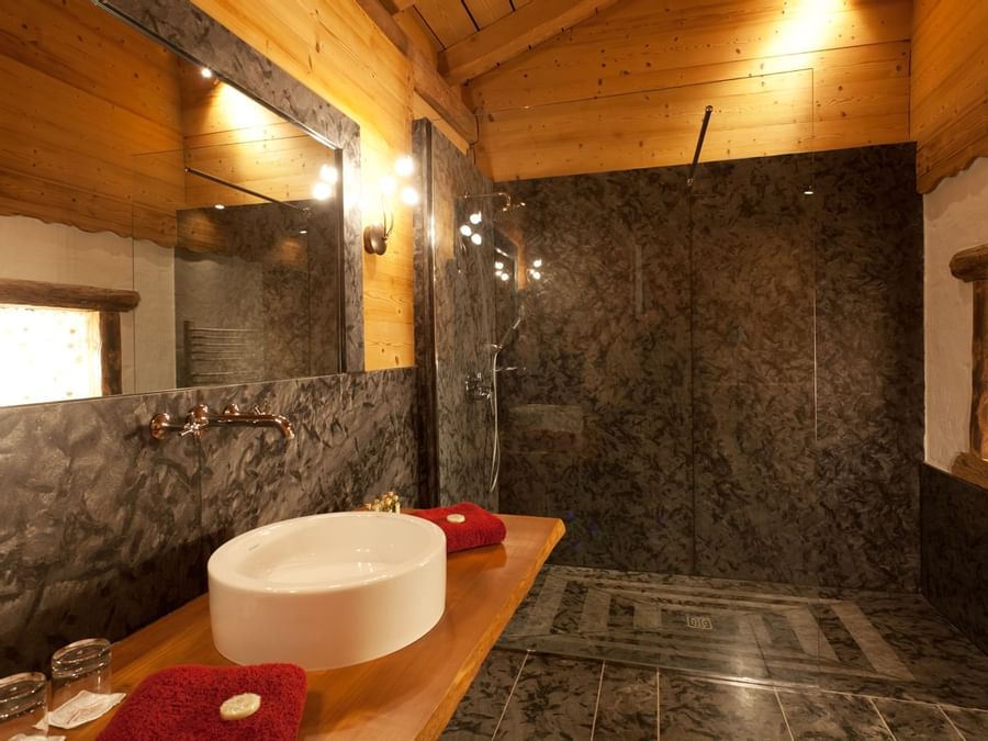 Bathroom in la ferme des fontany chalet at The Originals Hotels