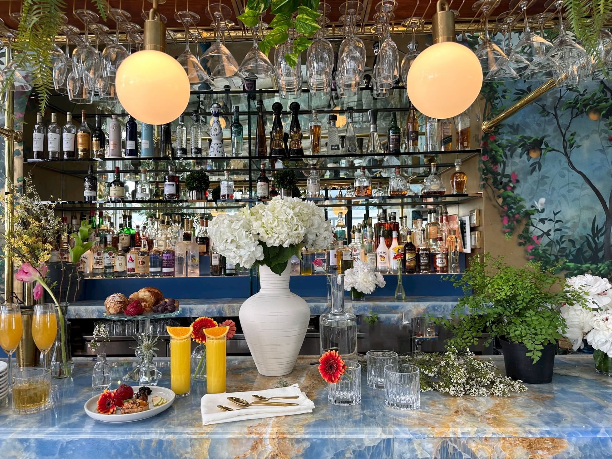 Rooftop Setup with food, florals, and glassware