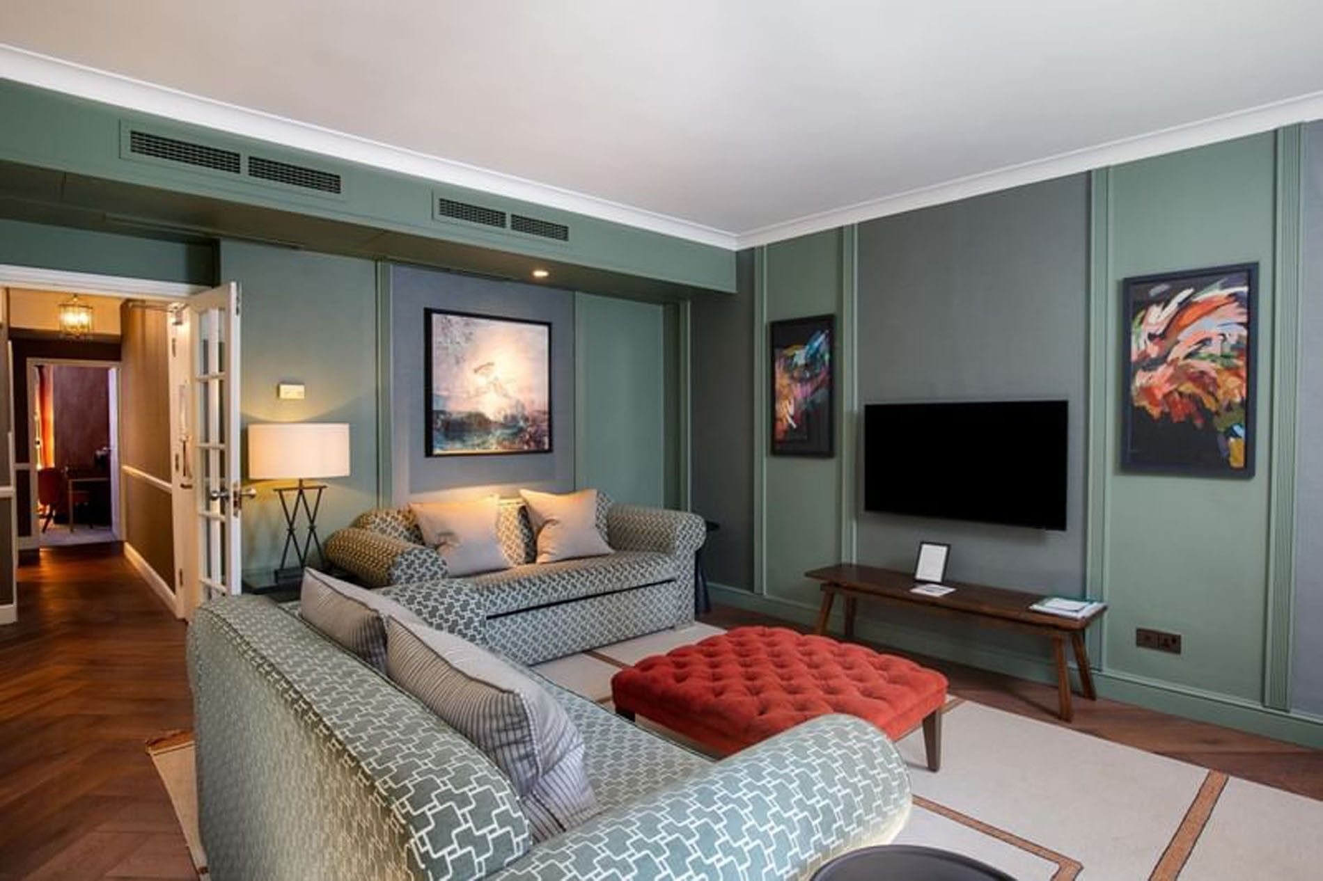 TV lounge with plush seating in Two Bedroom Apartment at The Capital Hotel, Apartments and Townhouse
