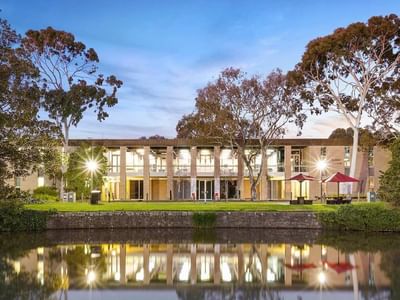La Trobe University - Glenn College building with a reflection in the water.