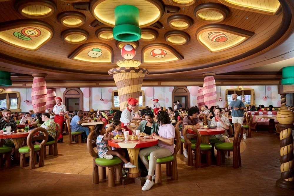 Diners enjoy sitting at cartoon-inspired tables beneath a round ceiling designed to resemble a toadstool. 