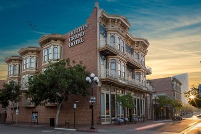 Exterior view of Horton Grand Hotel with sunset