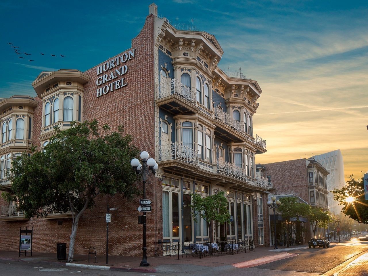 Exterior view of Horton Grand Hotel with street view on a sunny day