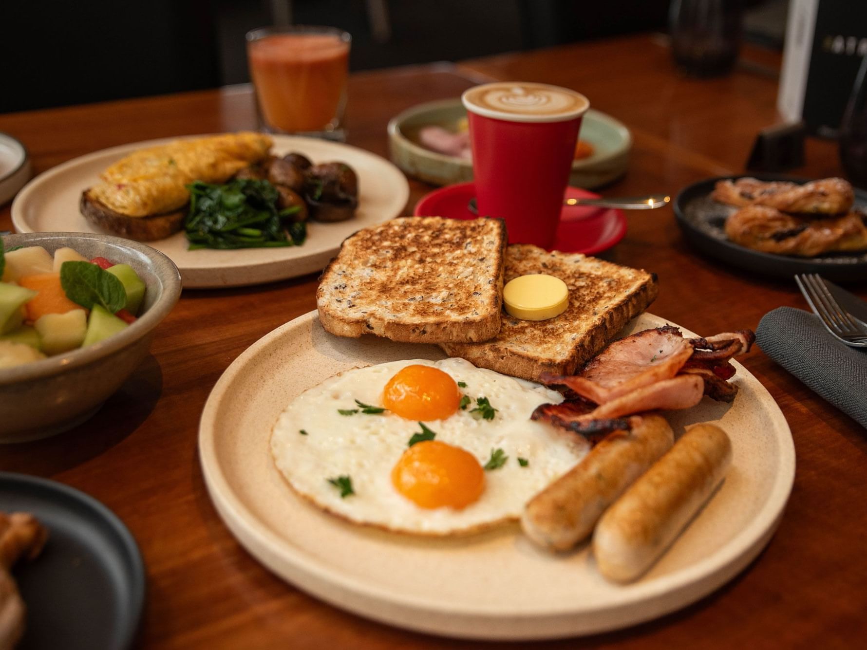 Close up of a classic English breakfast with cappuccino in Tasman Restaurant at Hotel Grand Chancellor Hobart