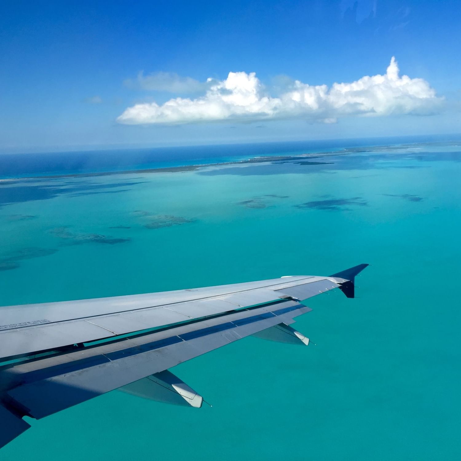 Ocean view from the airplane over the Somerset On Grace Bay