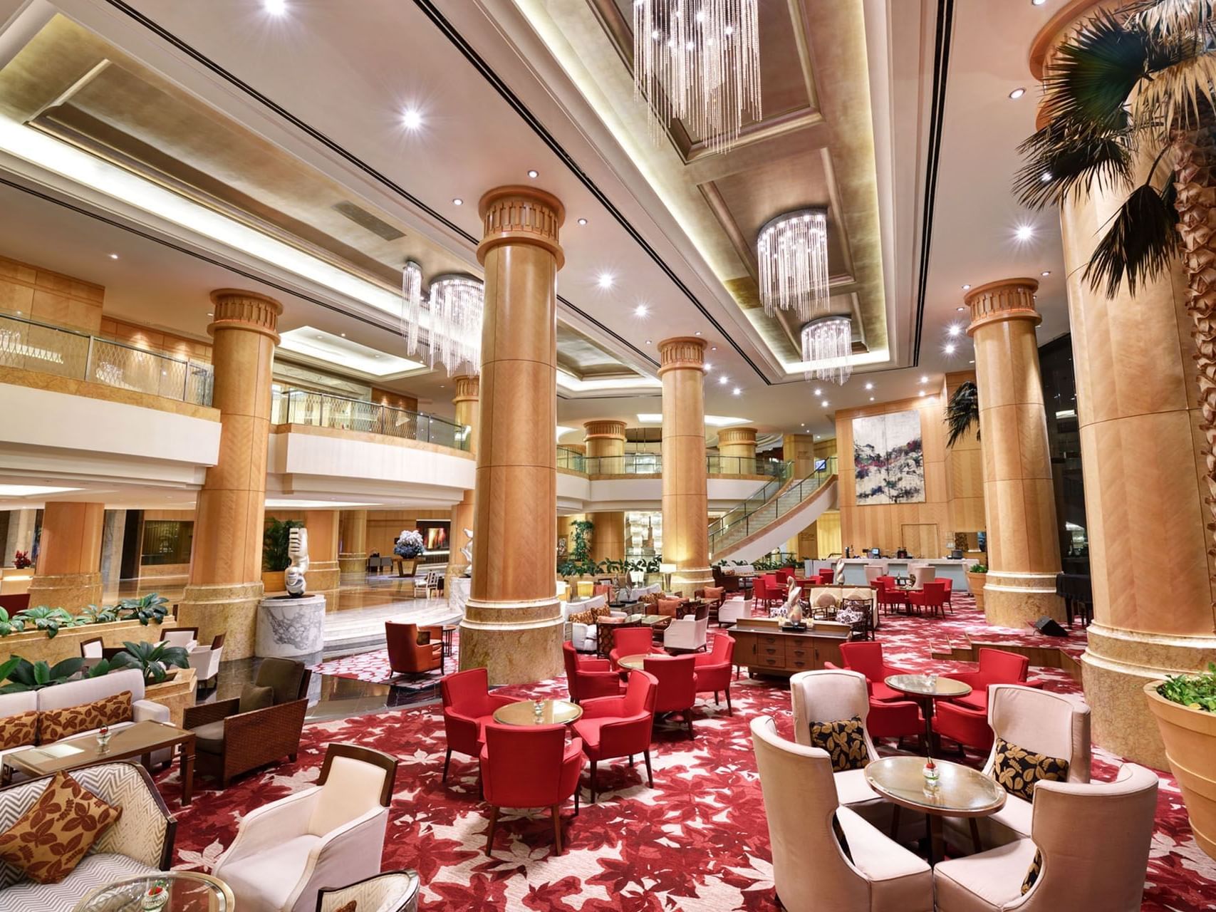 Sphere Lounge featuring white & red themed interior with large chandeliers at One World Hotel