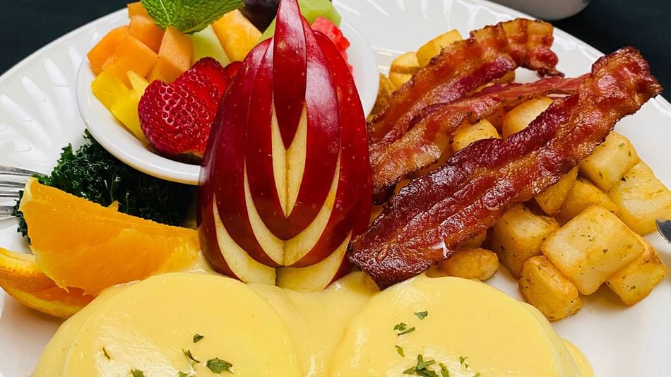 Monica's Classic Eggs Benedict dish at Stanford Inn & Suites