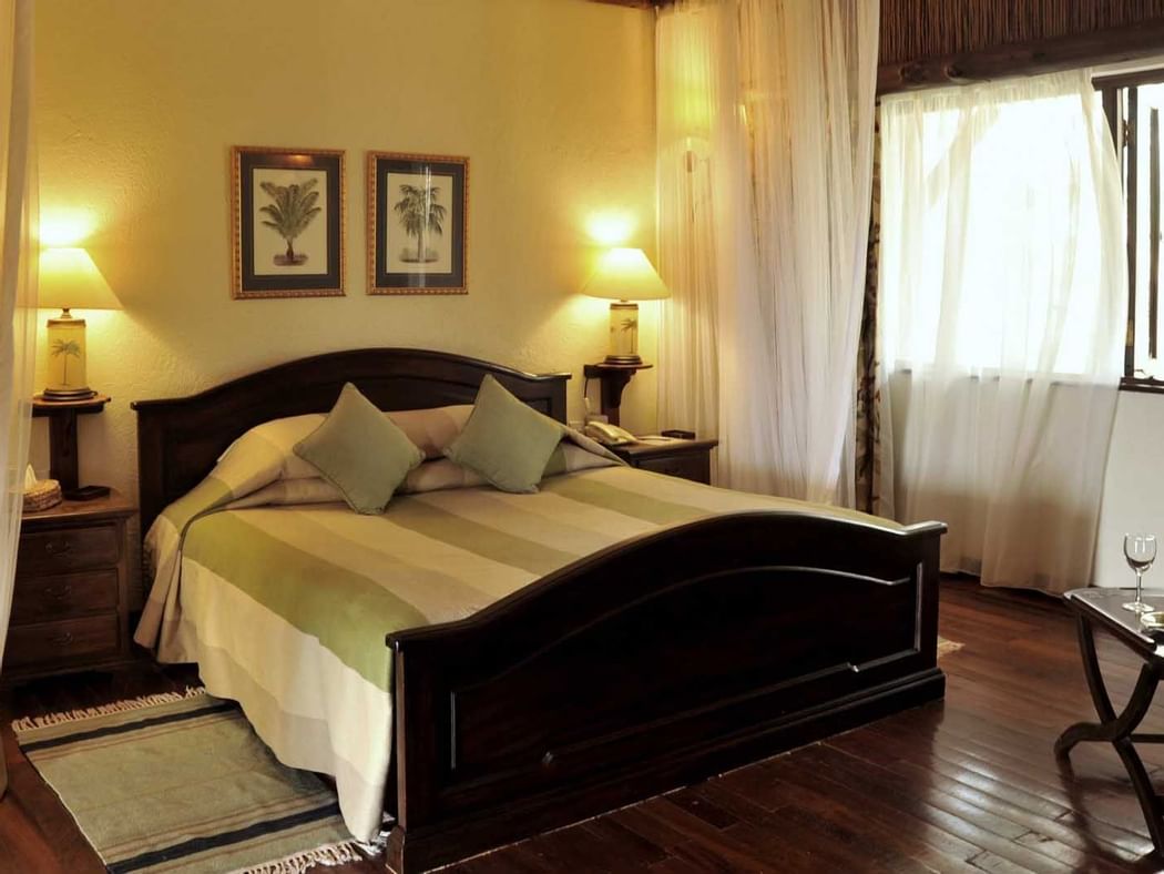 A Kings bed in Suite bedroom at Hotel Kilaguni Serena
