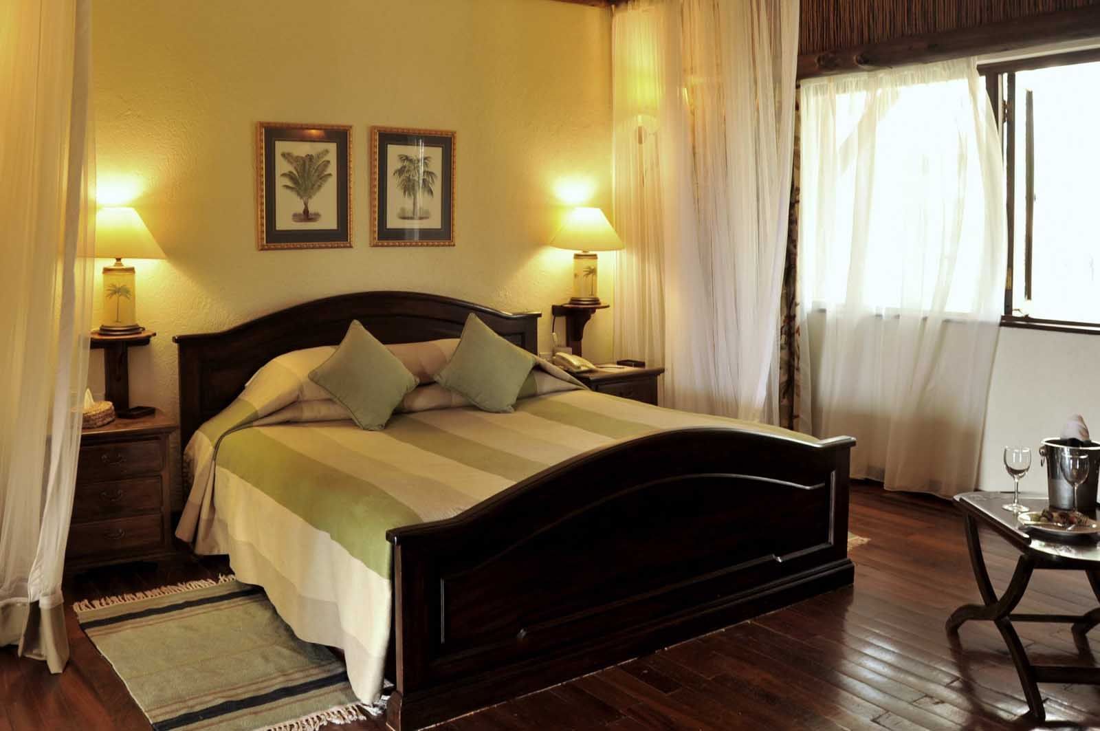 A Kings bed in Suite bedroom at Hotel Kilaguni Serena