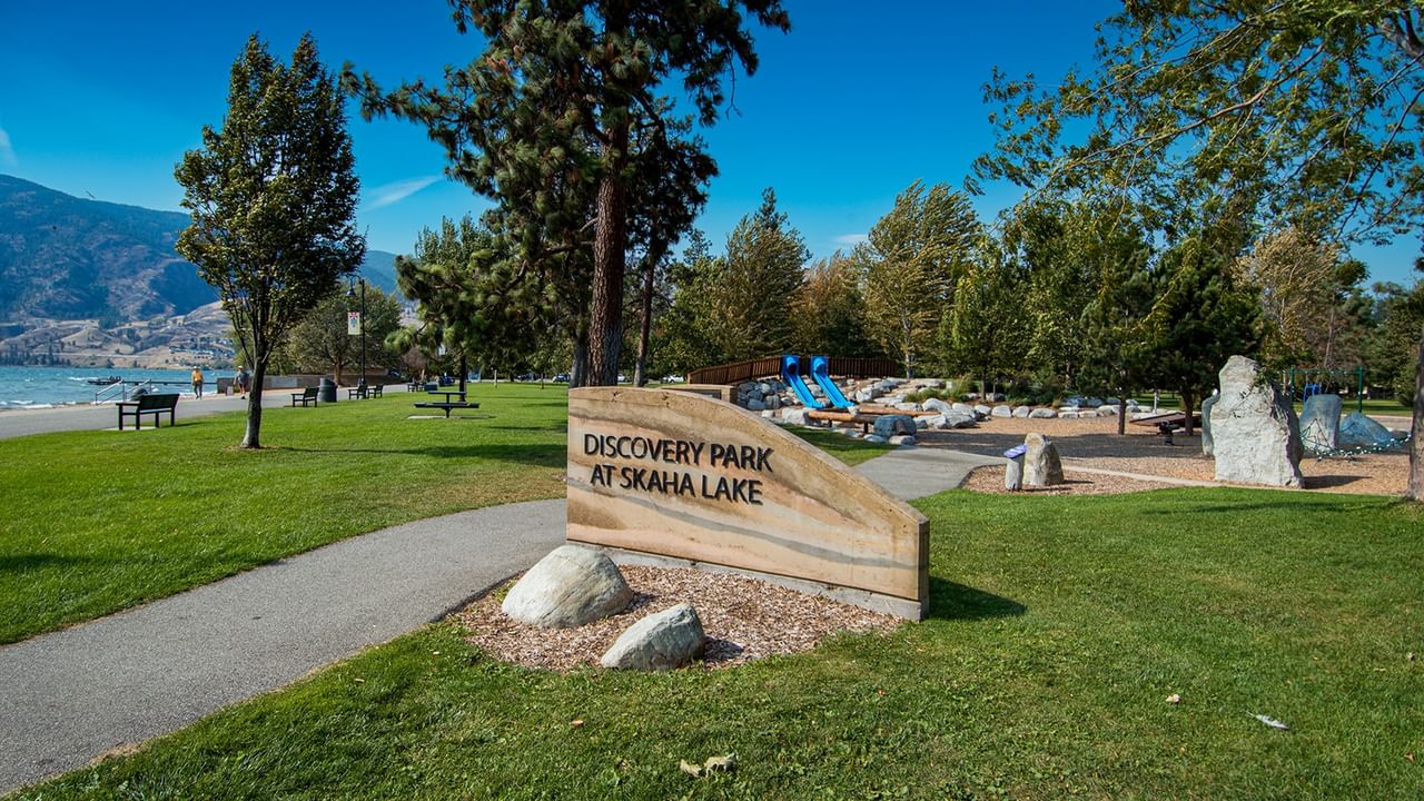 Discovery Park at Skaha Lake with a sandy lake beach and playground.