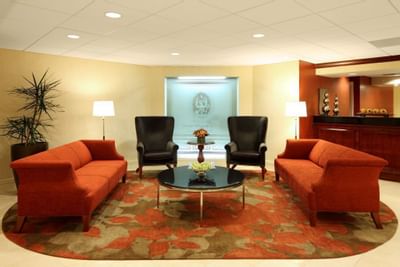 lobby with couches on carpet