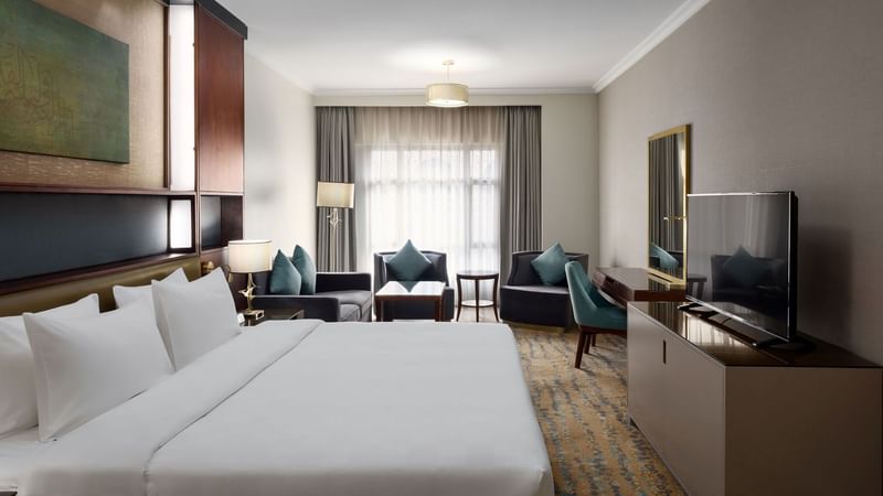 Spacious Executive King Room with modern decor and amenities at Saja by Warwick Madinah.