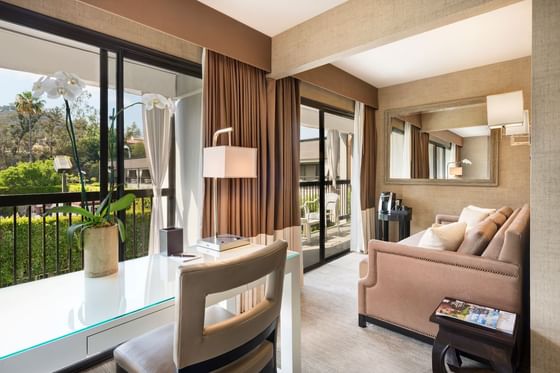 Comfy sofas turned towards the garden in Executive Junior Suite at Luxe Sunset Boulevard Hotel
