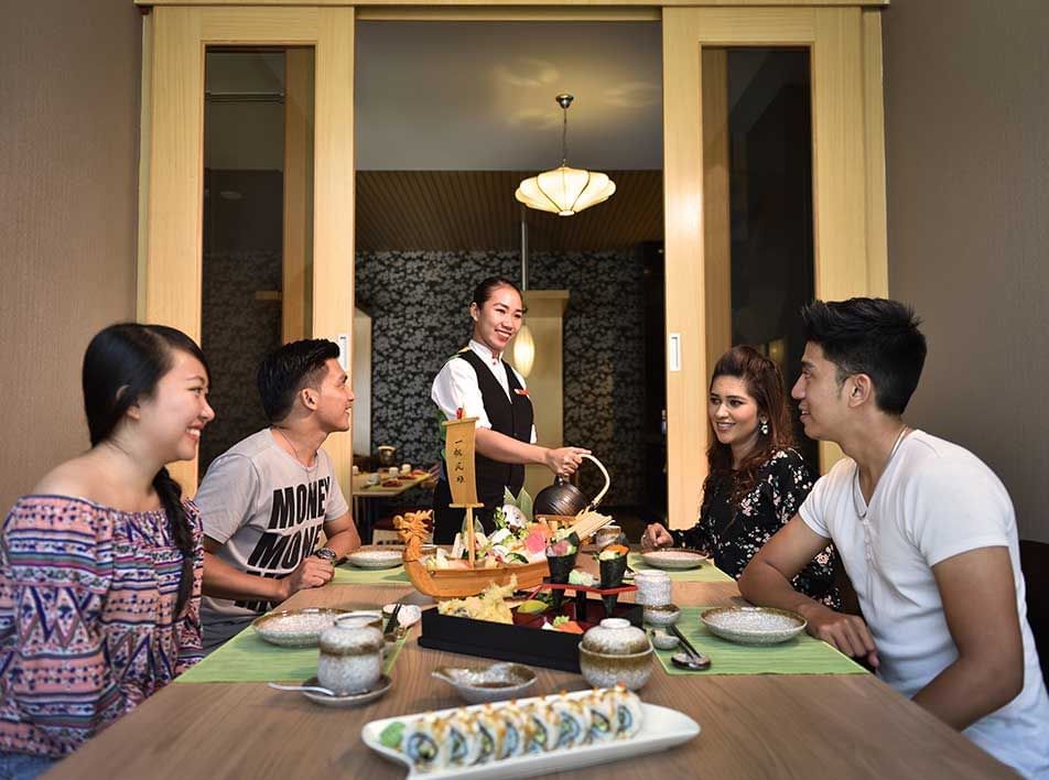 family seated at UMI Japanese restaurant in Lexis Hotel and Resort