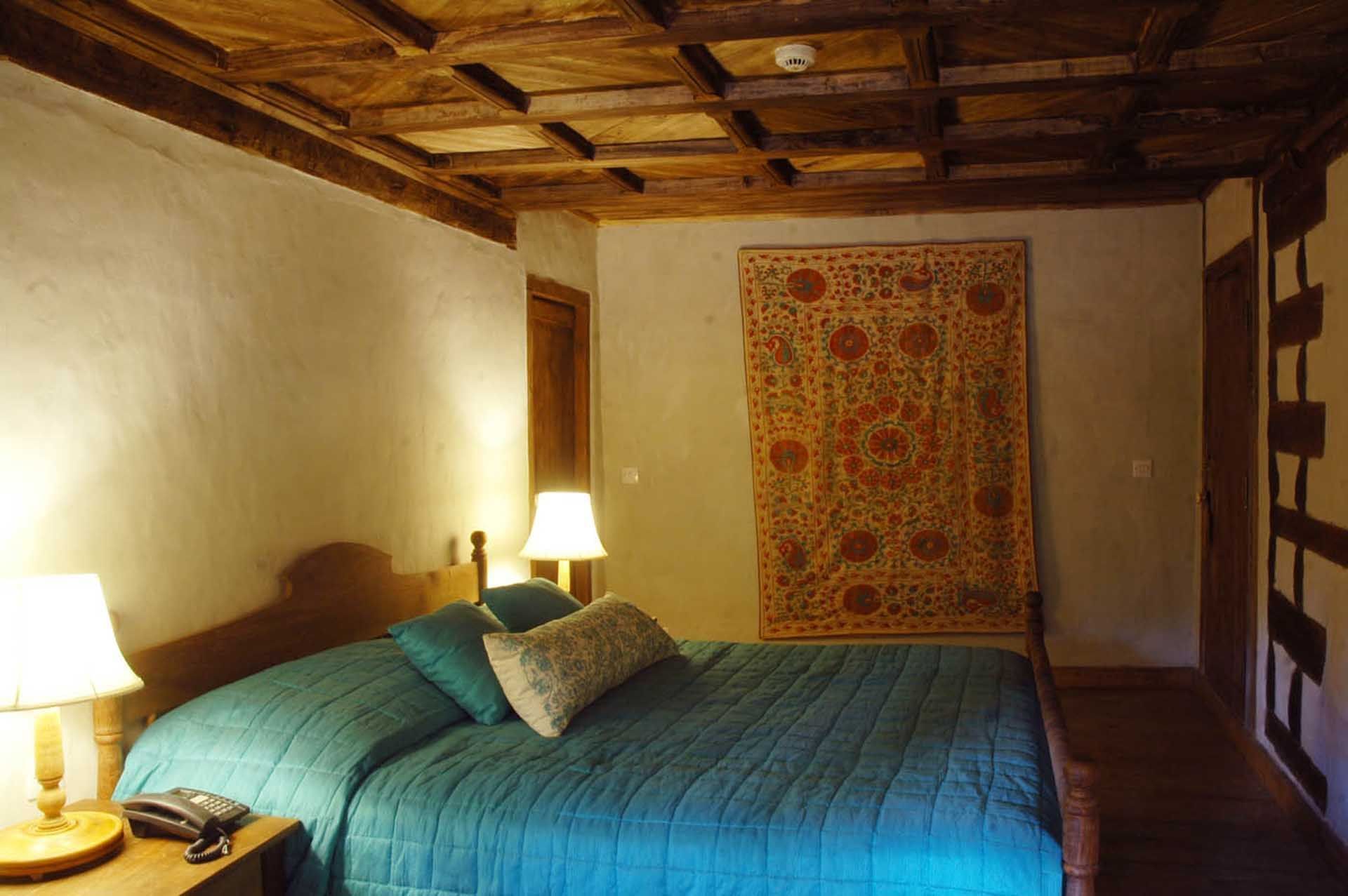 Interior of a bedroom in a hotel room at Serena Khaplu Palace