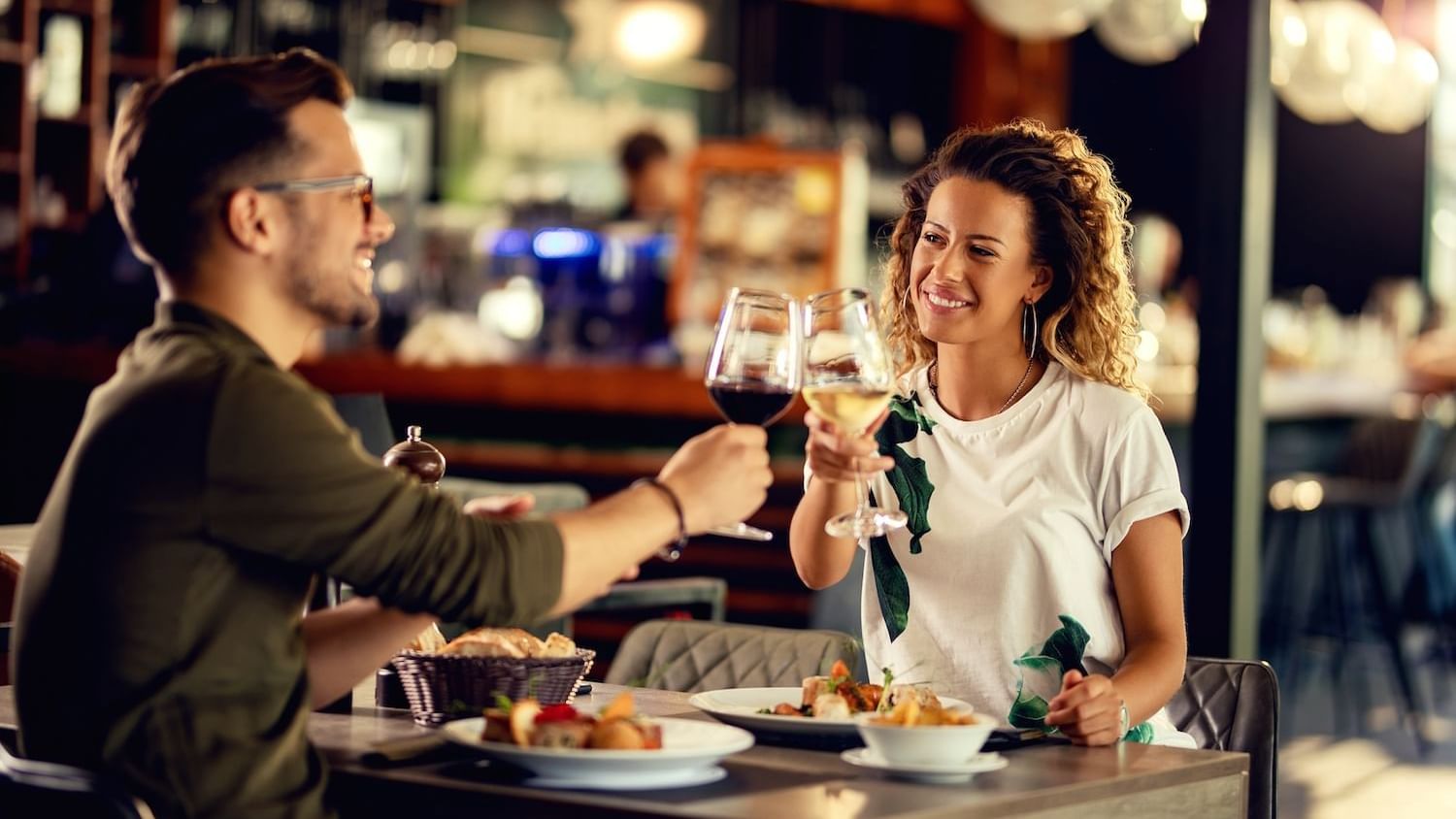 Couple enjoying their wine & meals in a Restaurant at Cove Pocono Resorts