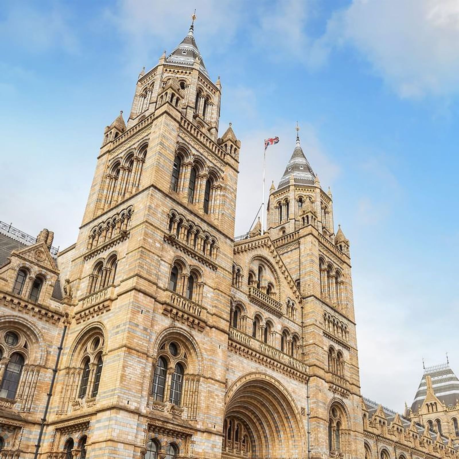 Towers of the Natural History Museum constructed of intricate brickwork near The Capital Hotel, Apartments and Townhouse