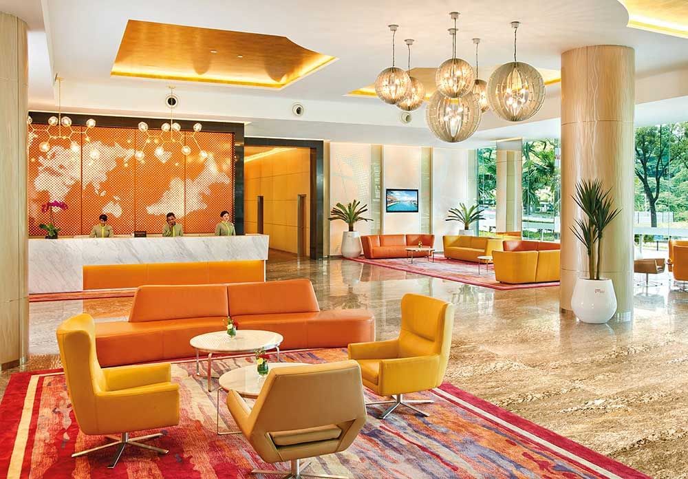 Lobby area with front desk with receptionists at Sunway Velocity Hotel