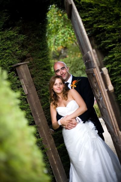 Bride and groom posing for a picture