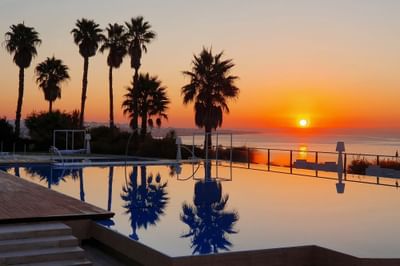 Infinity pool with Sea view at Hotel Cascais Miragem Health & Spa during sunset