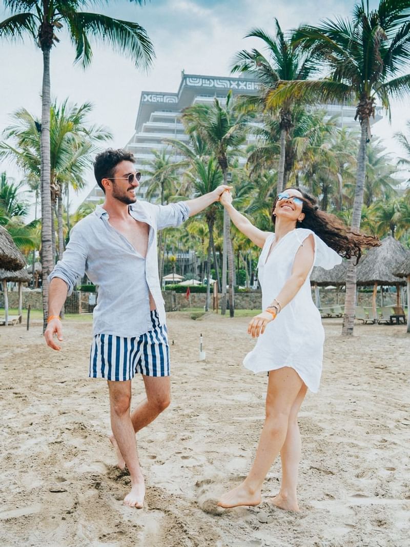 A couple by the beach at Princess Mundo Imperial