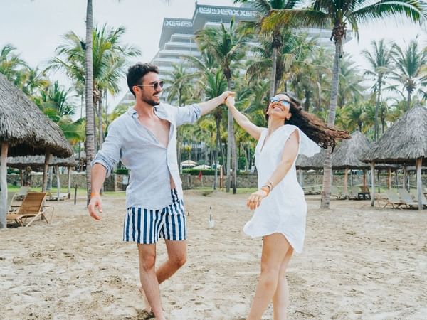 A couple by the beach at Princess Mundo Imperial