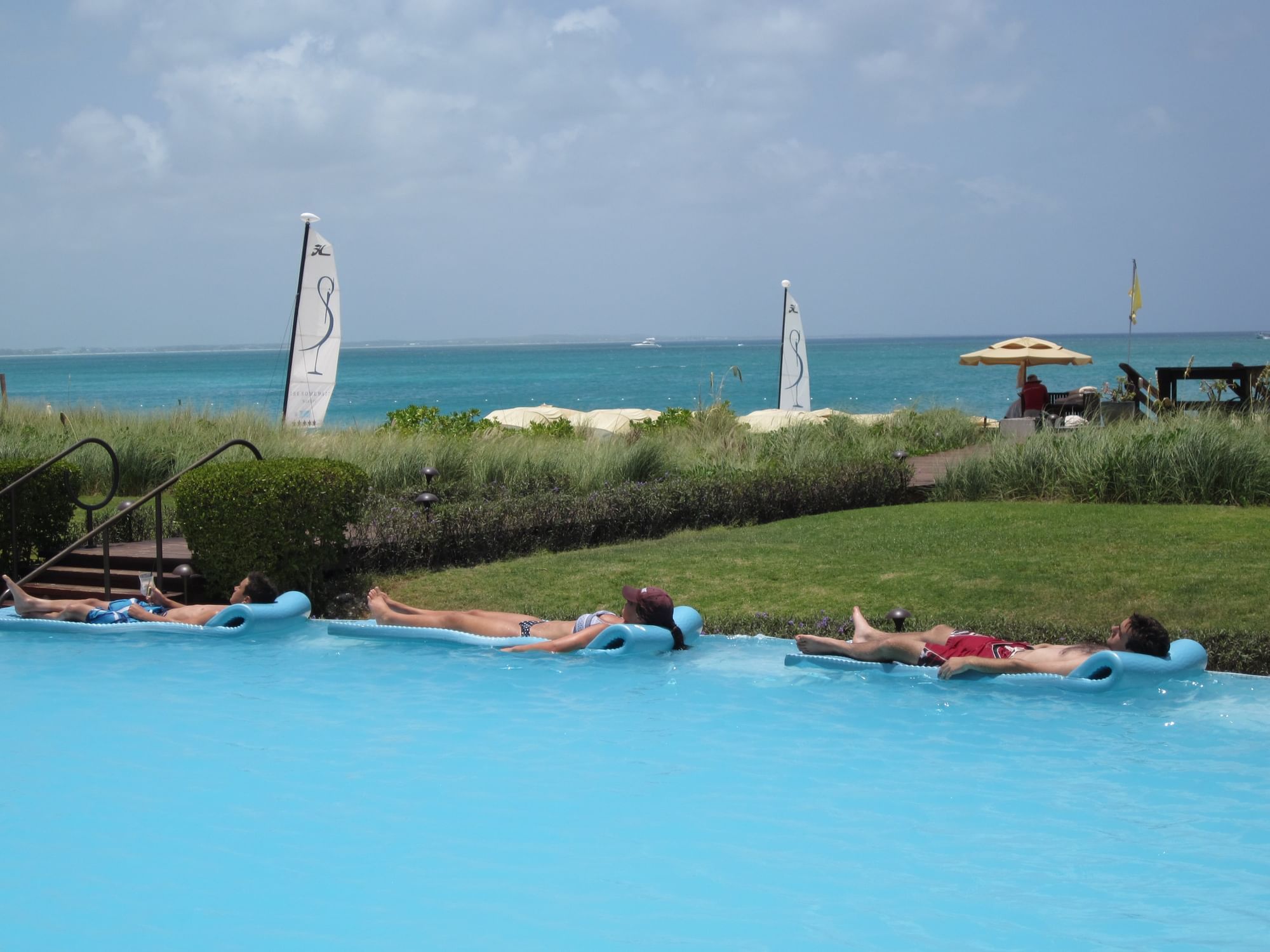 Tourists sunbathing at The Somerset On Grace Bay