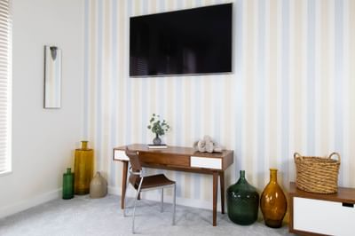 TV, striped wallpaper & work desk in King Premiere Palm at Retro Suites Hotel