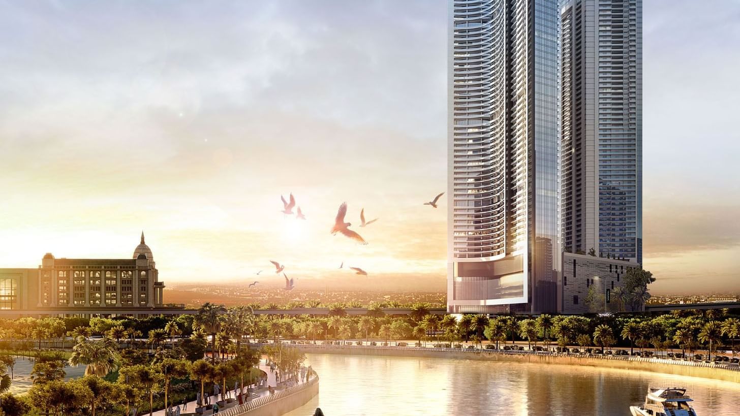 Exterior view of DAMAC Maison Aykon City Hotel Apartments with sunset