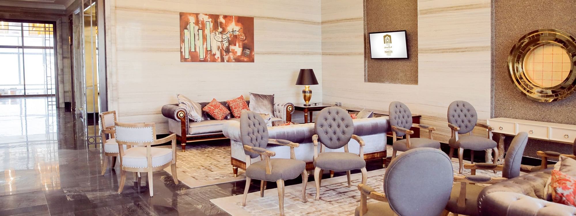 Luxury interior of the lobby area with comfy seats at Naviti By Warwick Dammam