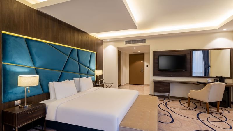 Panorama Suite with bed working area and TV at Warwick Riyadh