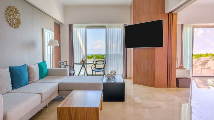 Living area with seating and TV at Live Aqua Cancún