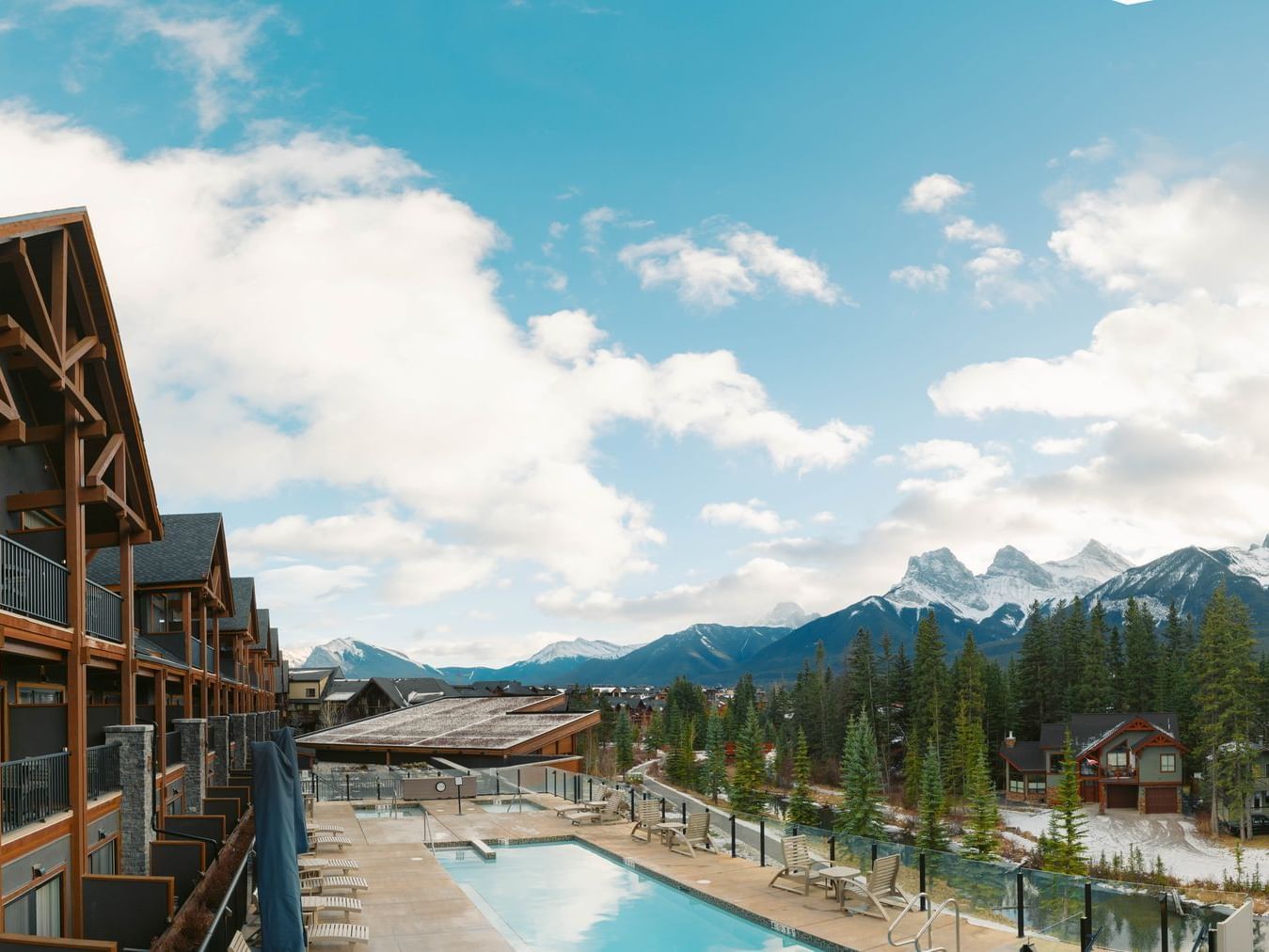 Balcony view of The Malcolm Hotel surrounded by mountains