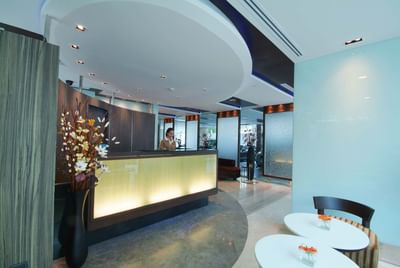 Receptionist, front reception desk in Amora Neoluxe Hotel