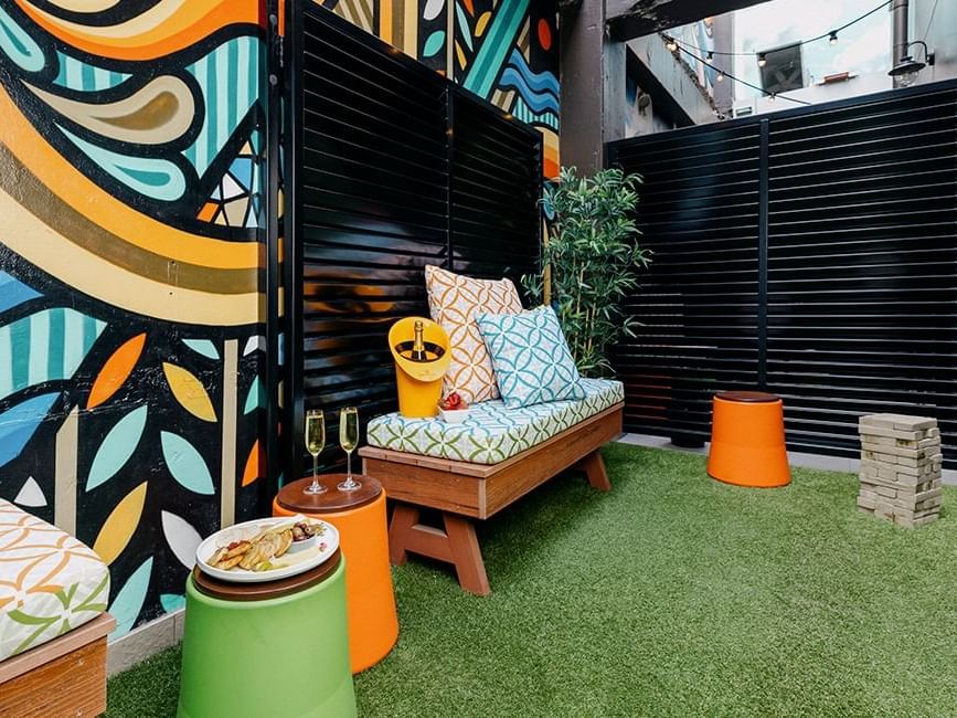 Private art-adorned courtyard with door into bedroom