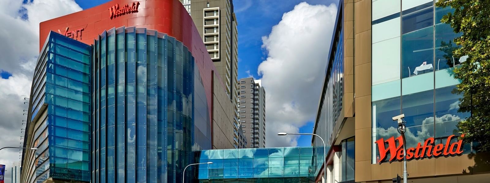 Westfield Paramatta near Novotel Sydney Parramatta, showing the modern glass bridge and busy street entrance