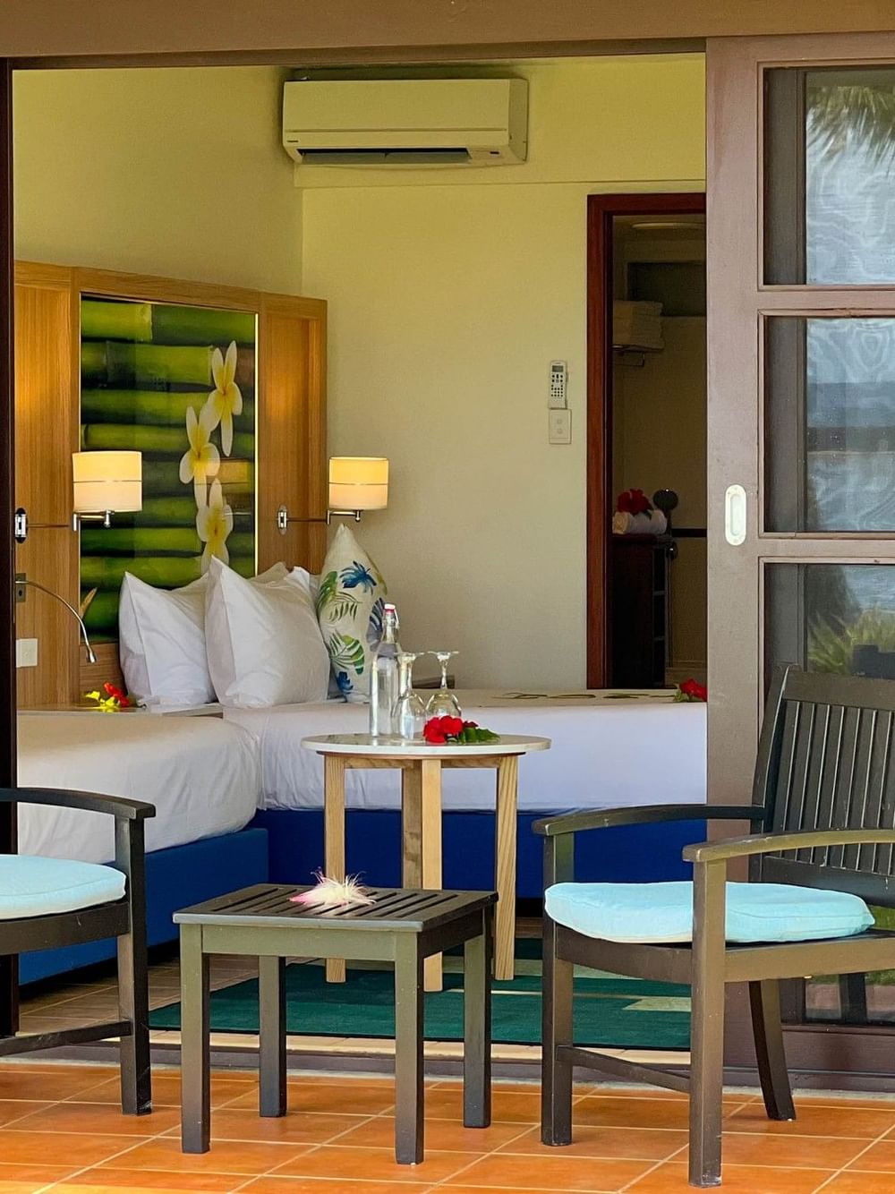 Ocean View Room patio with two chairs and table at The Naviti Resort in Korolevu.