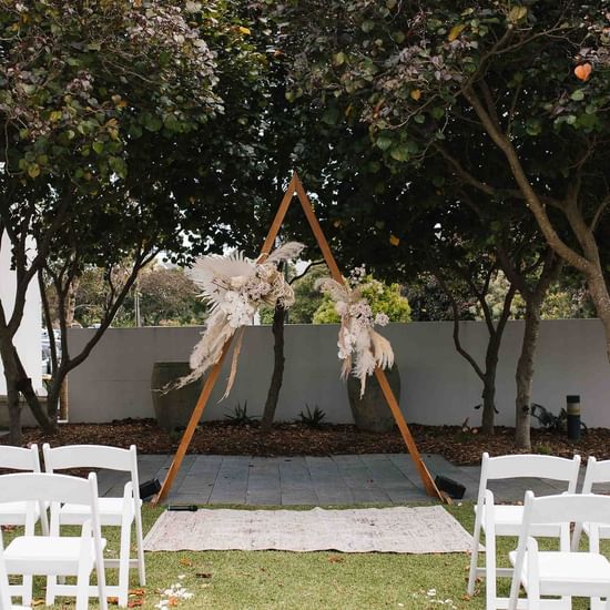 Chairs arranged with the aisle at Pullman Magenta Shores